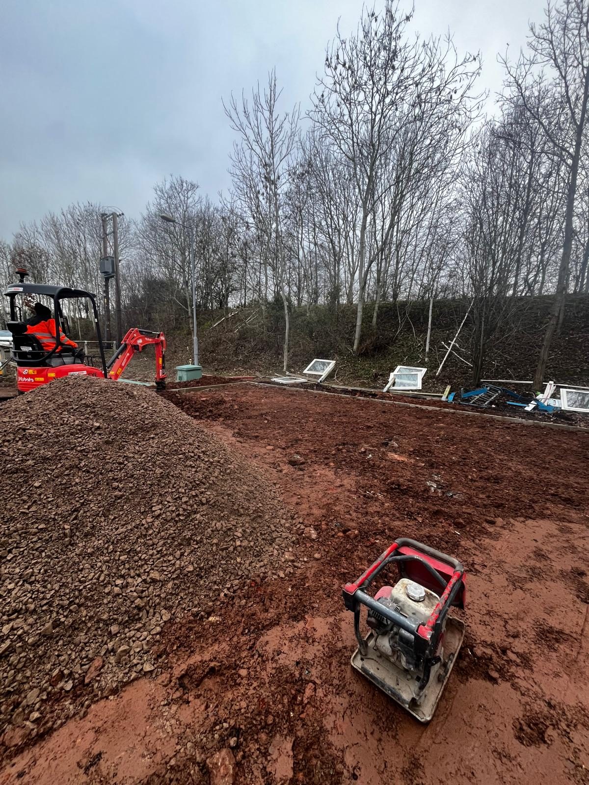 Plate compactor on a new stone sub-base