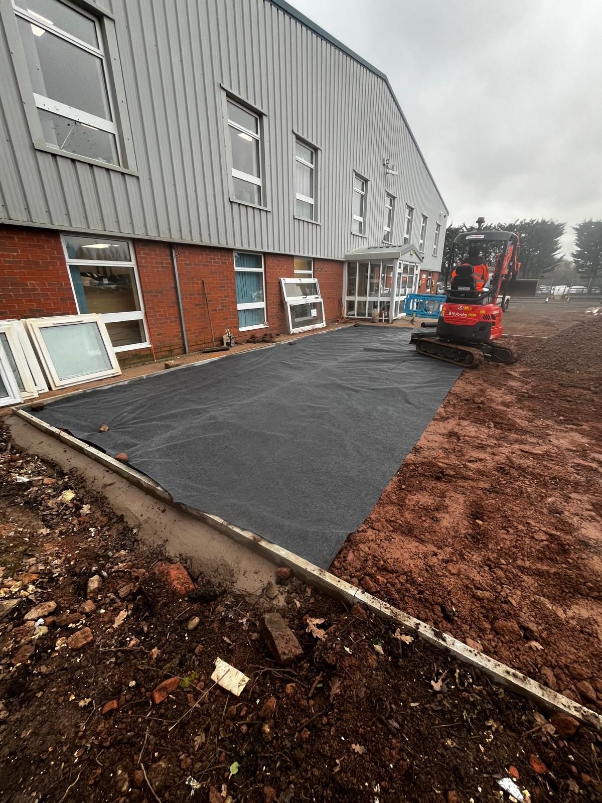 Geotextile membrane laid for a hard standing base
