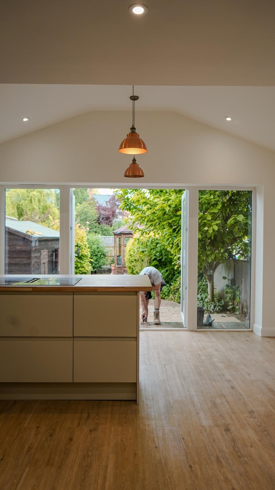 Open-plan kitchen extension with doors open to the garden