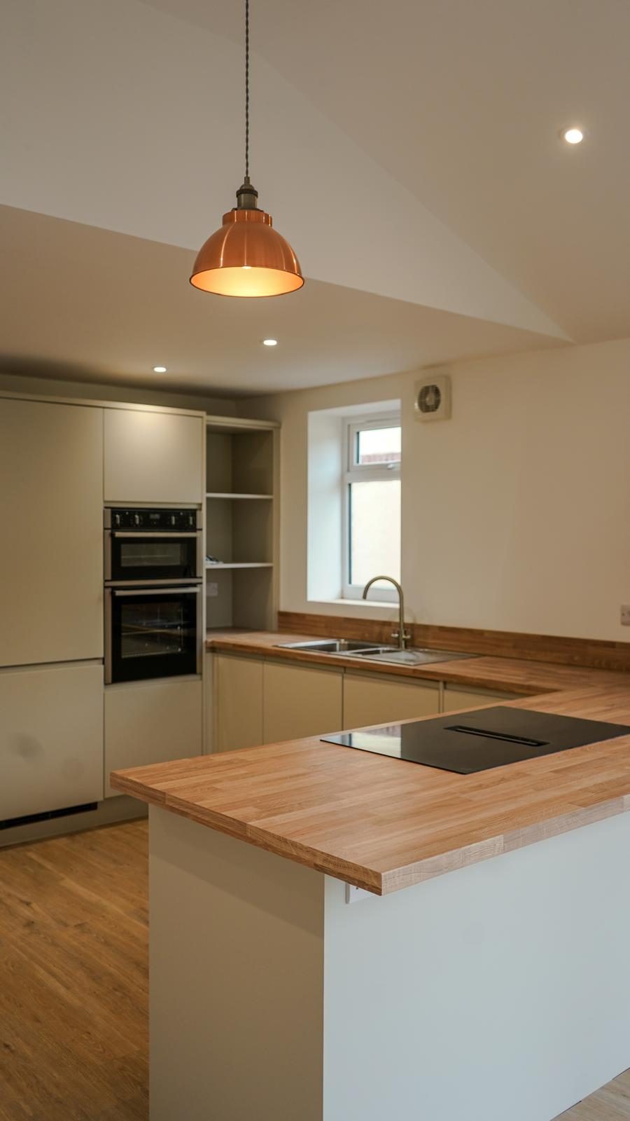 The finished open-plan kitchen by RM Property Renovations Ltd