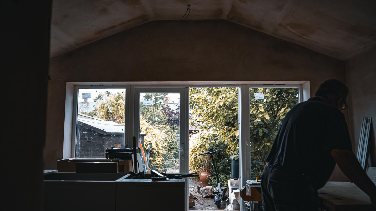 Freshly plastered extension interior with new glazed doors