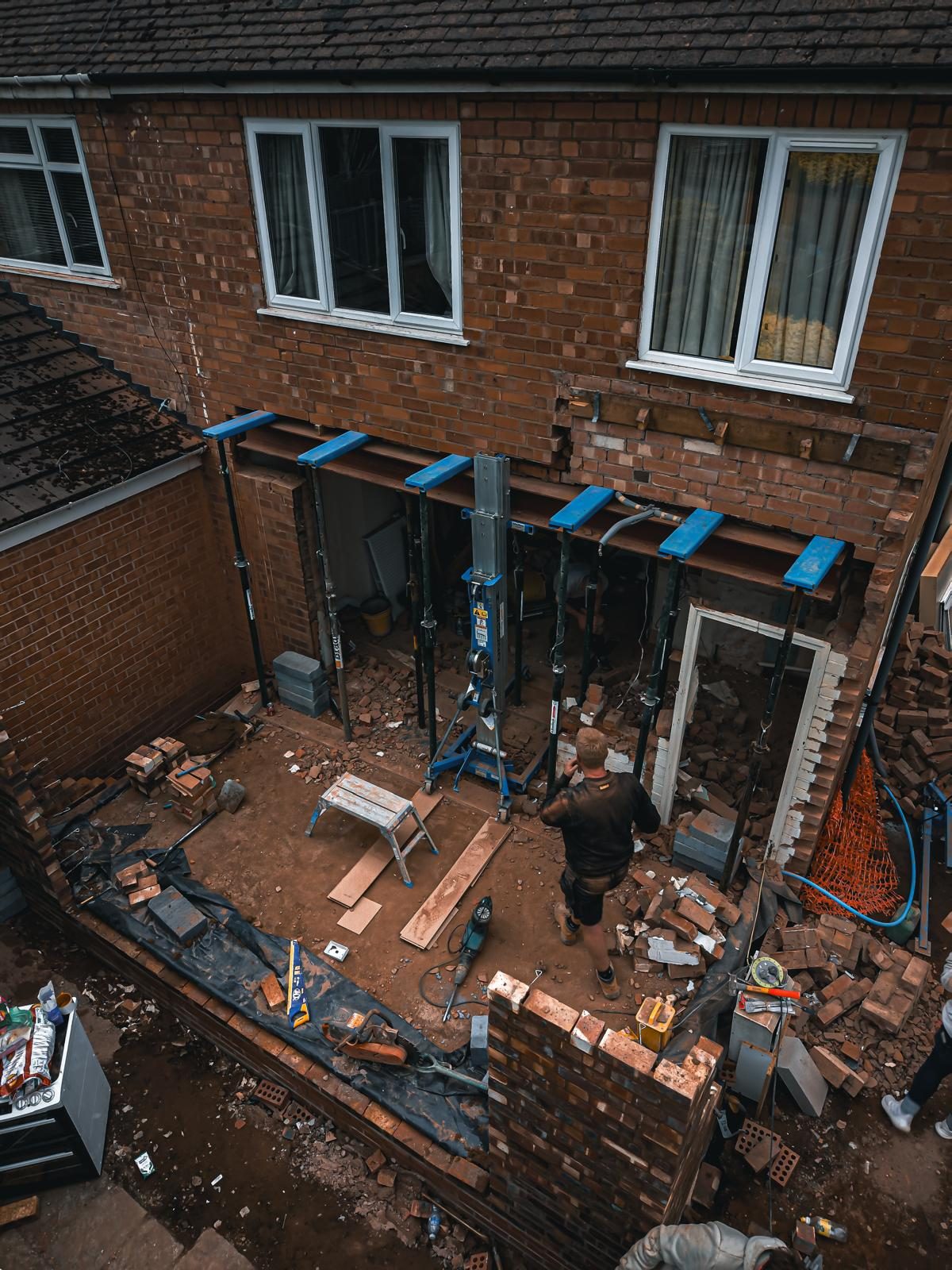 Rear wall openings supported on temporary props during extension work