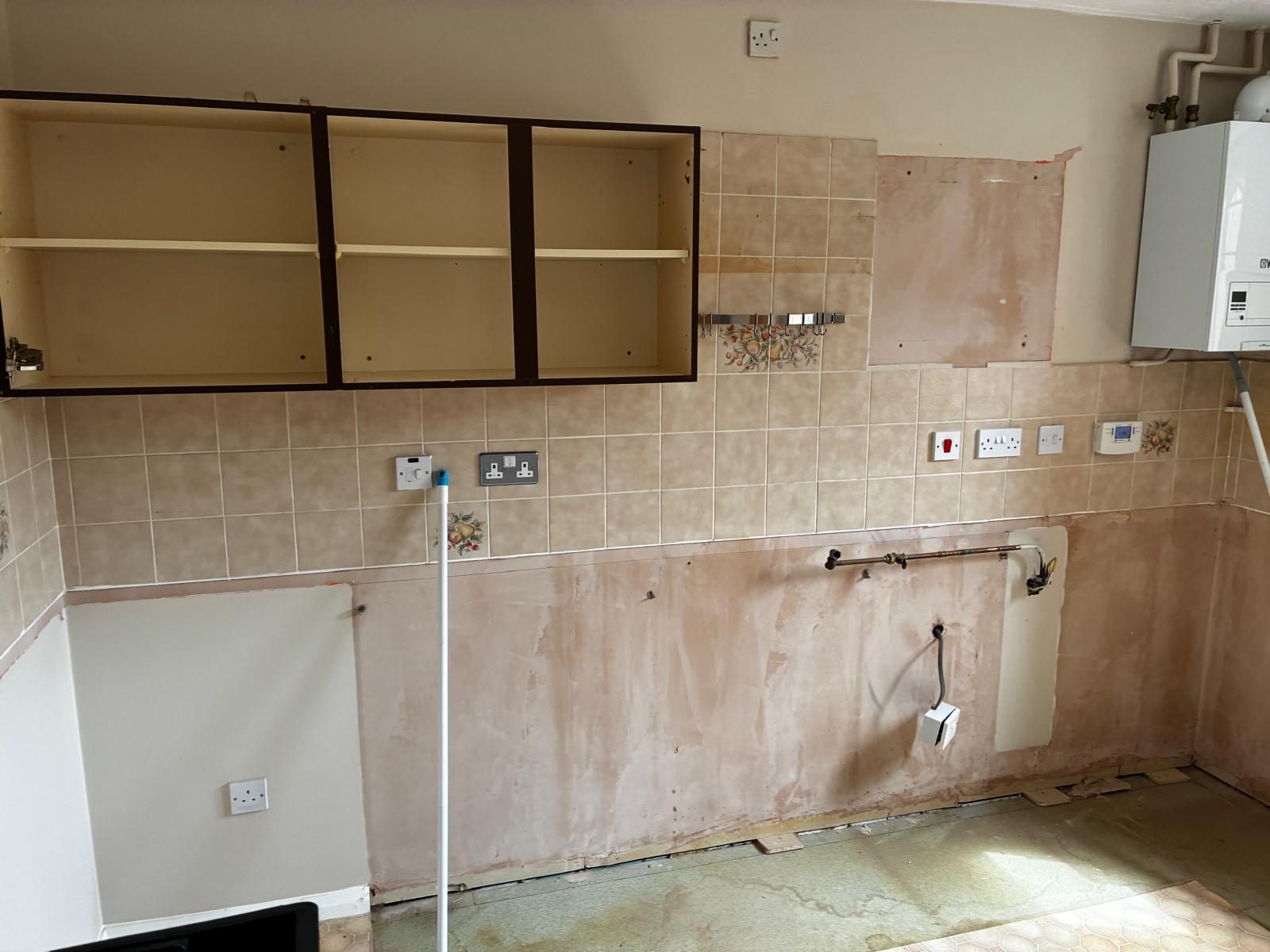 Kitchen stripped back to bare walls before refitting