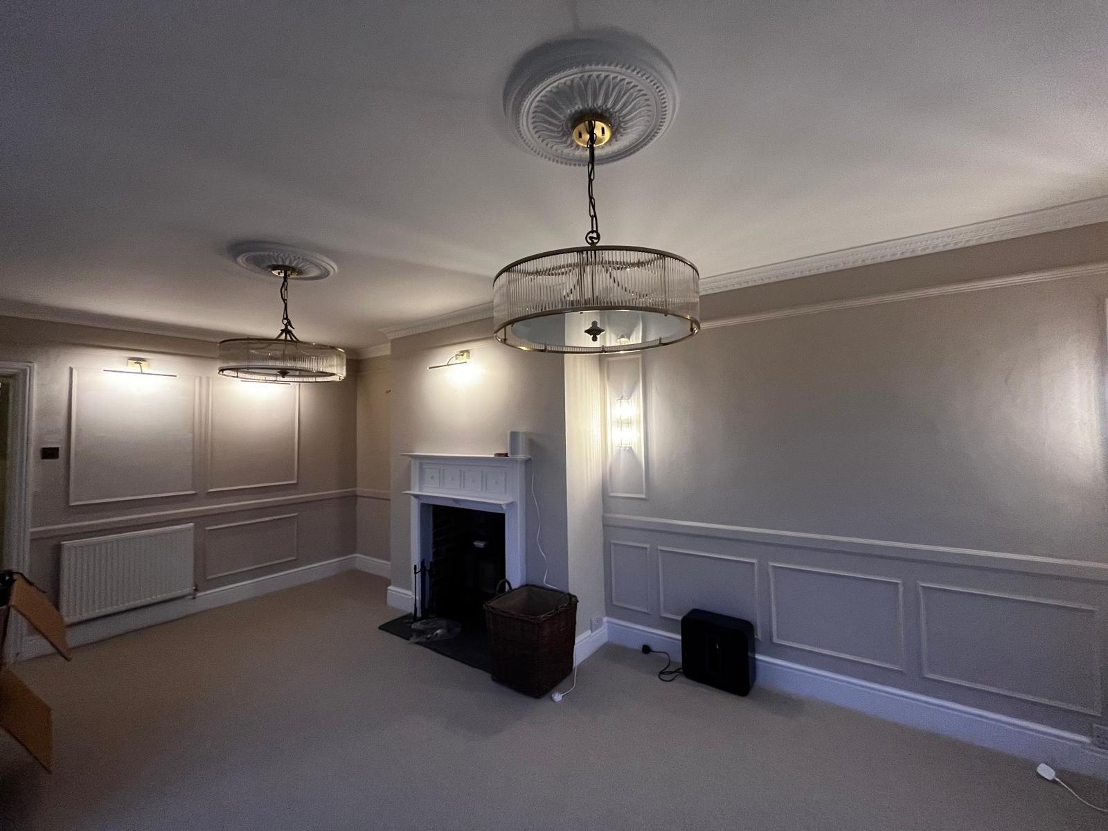 Completed front room with panelling, cornice and pendant lighting