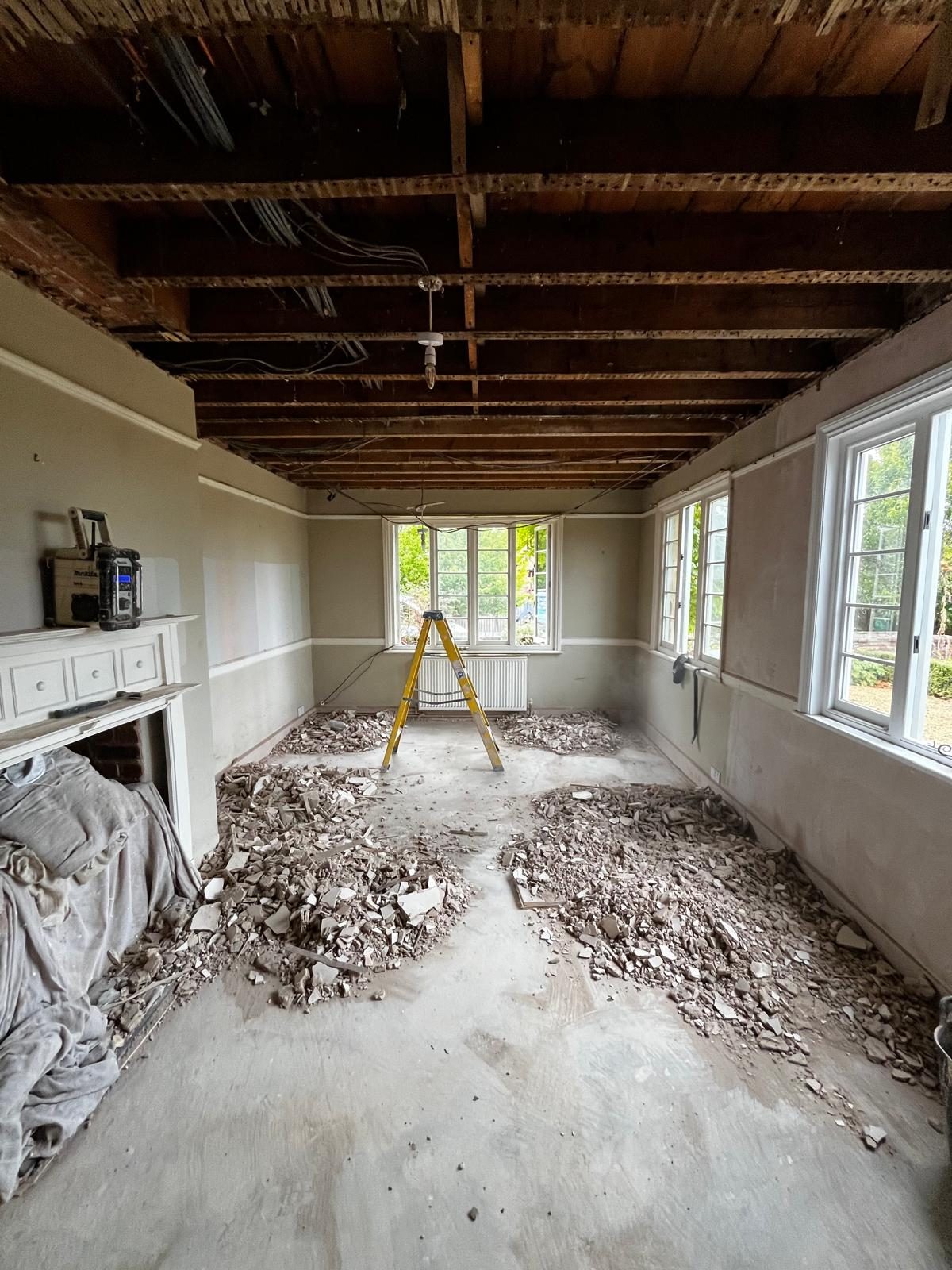 Front room with ceiling stripped back to the joists