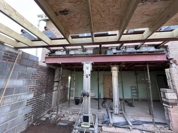 Steel RSJ beams and acrow props during structural work