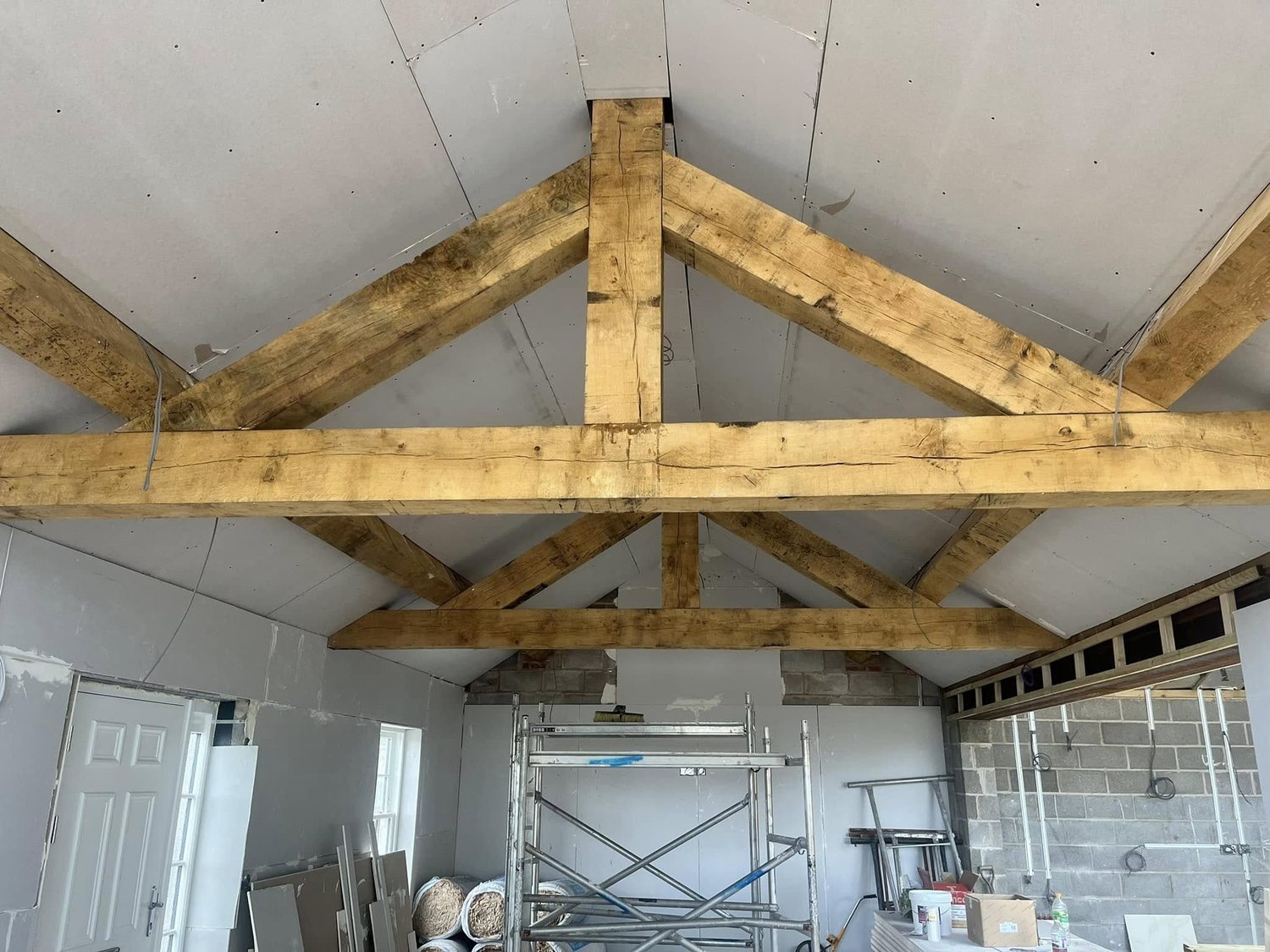 Exposed oak king-post roof trusses